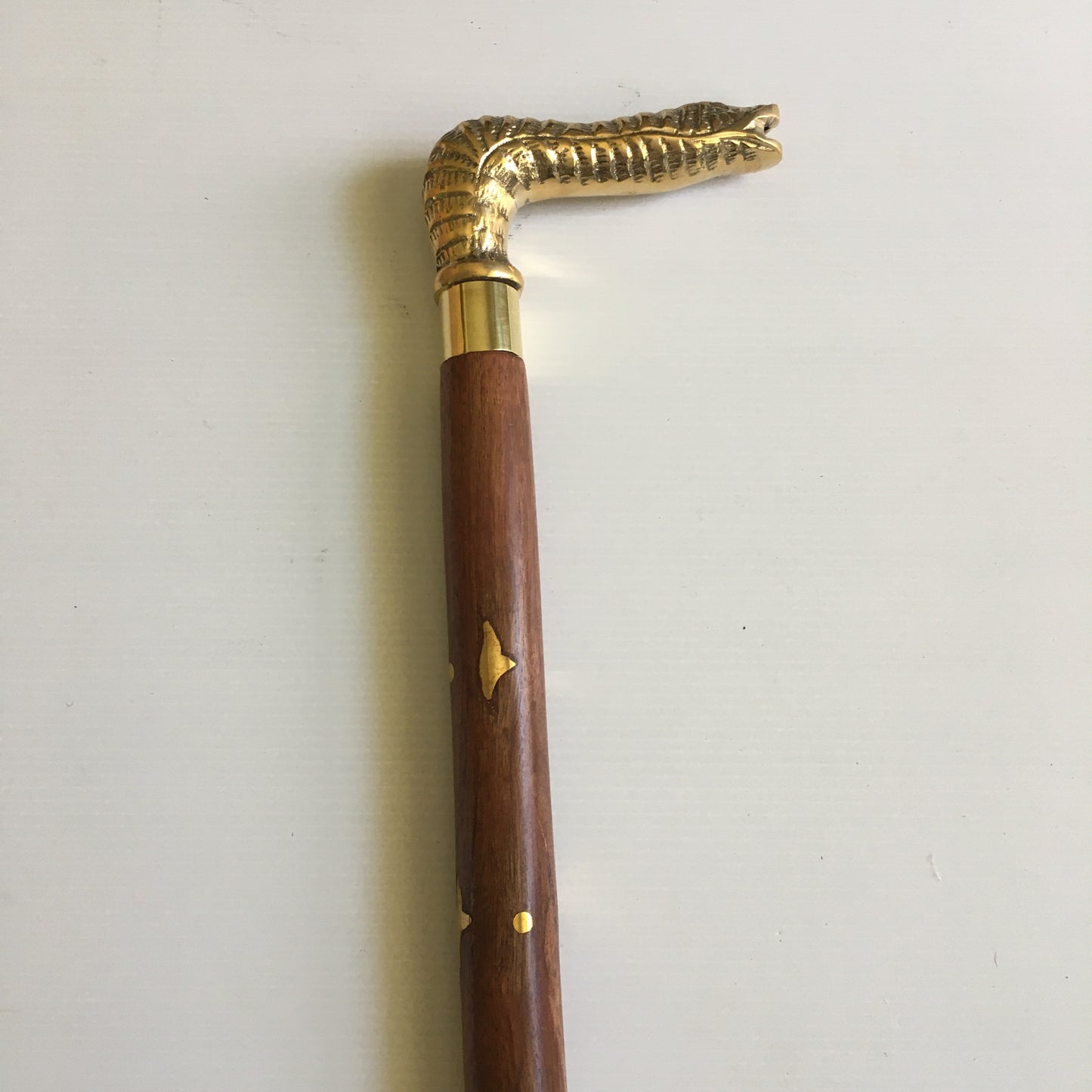 Walking Stick with Solid Brass Snakes Head Handle on a brown inlay stick
