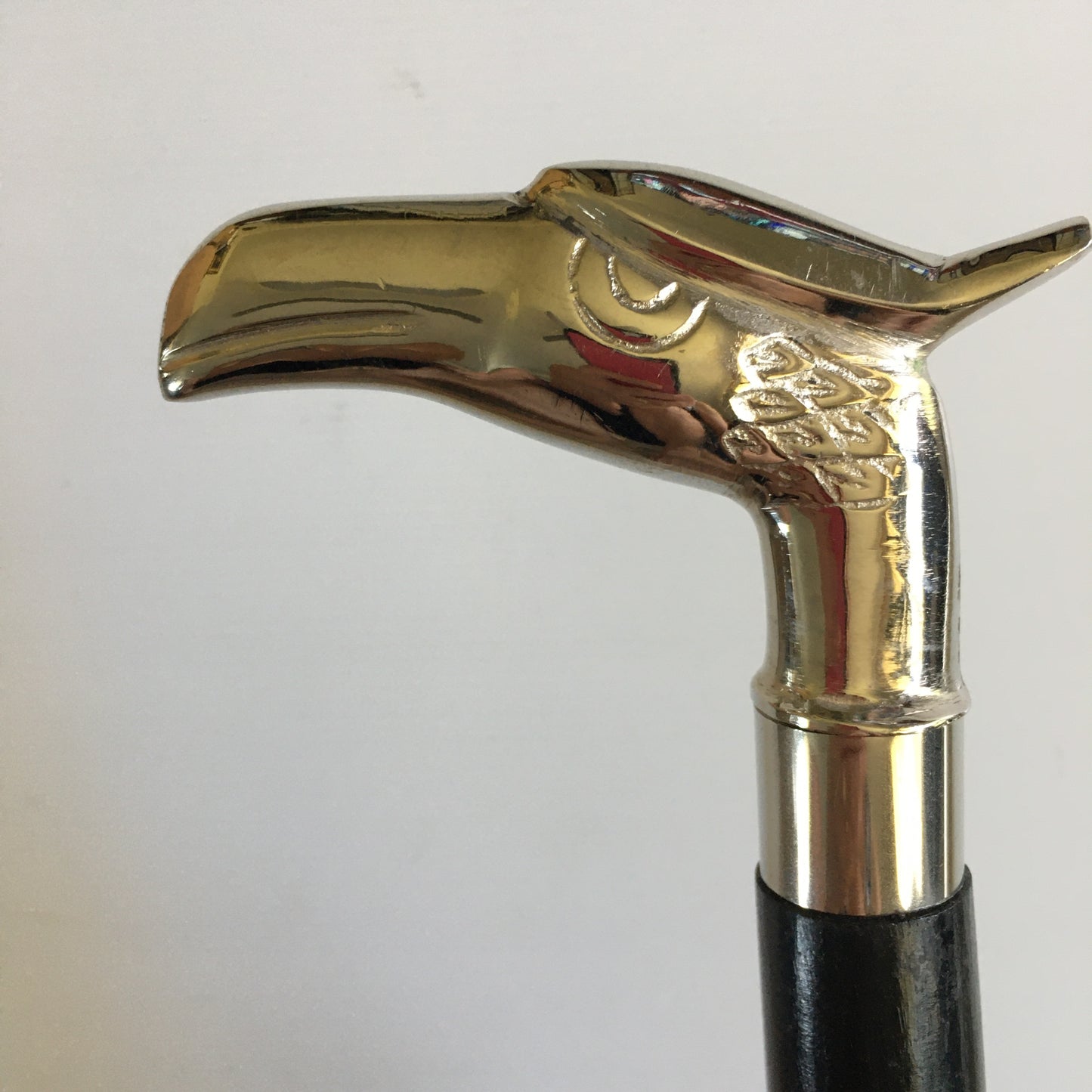 Walking Stick with Silver Eagles Head Handle on a Plain black stick