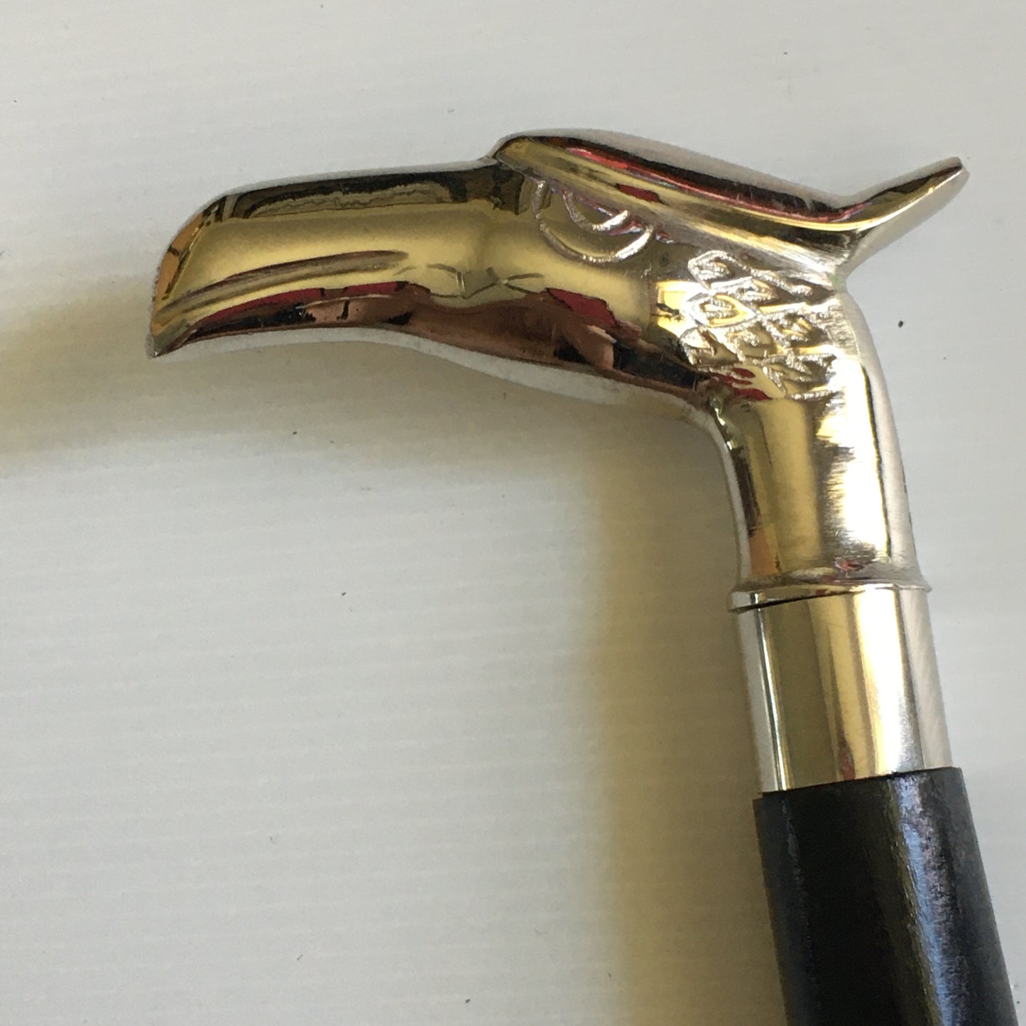 Walking Stick with Silver Eagles Head Handle on a Plain black stick