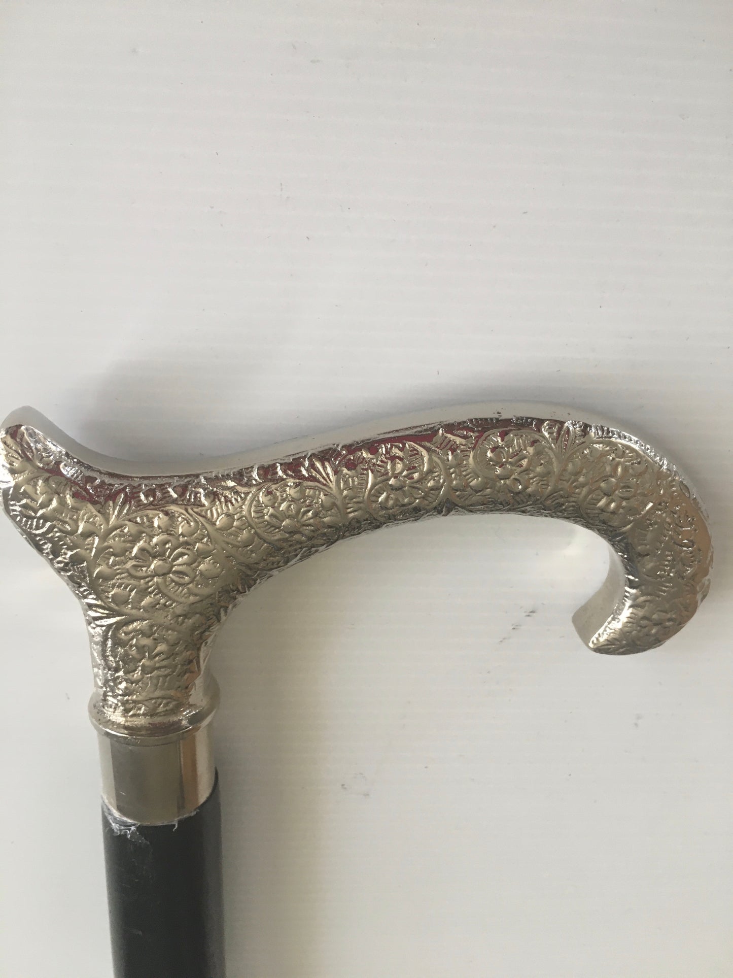 Walking Stick with Silver Goats Horn Handle on a plain Black Stick