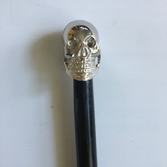 Walking Stick with Silver Skull design Handle on a Plain black stick or turned wood stick.